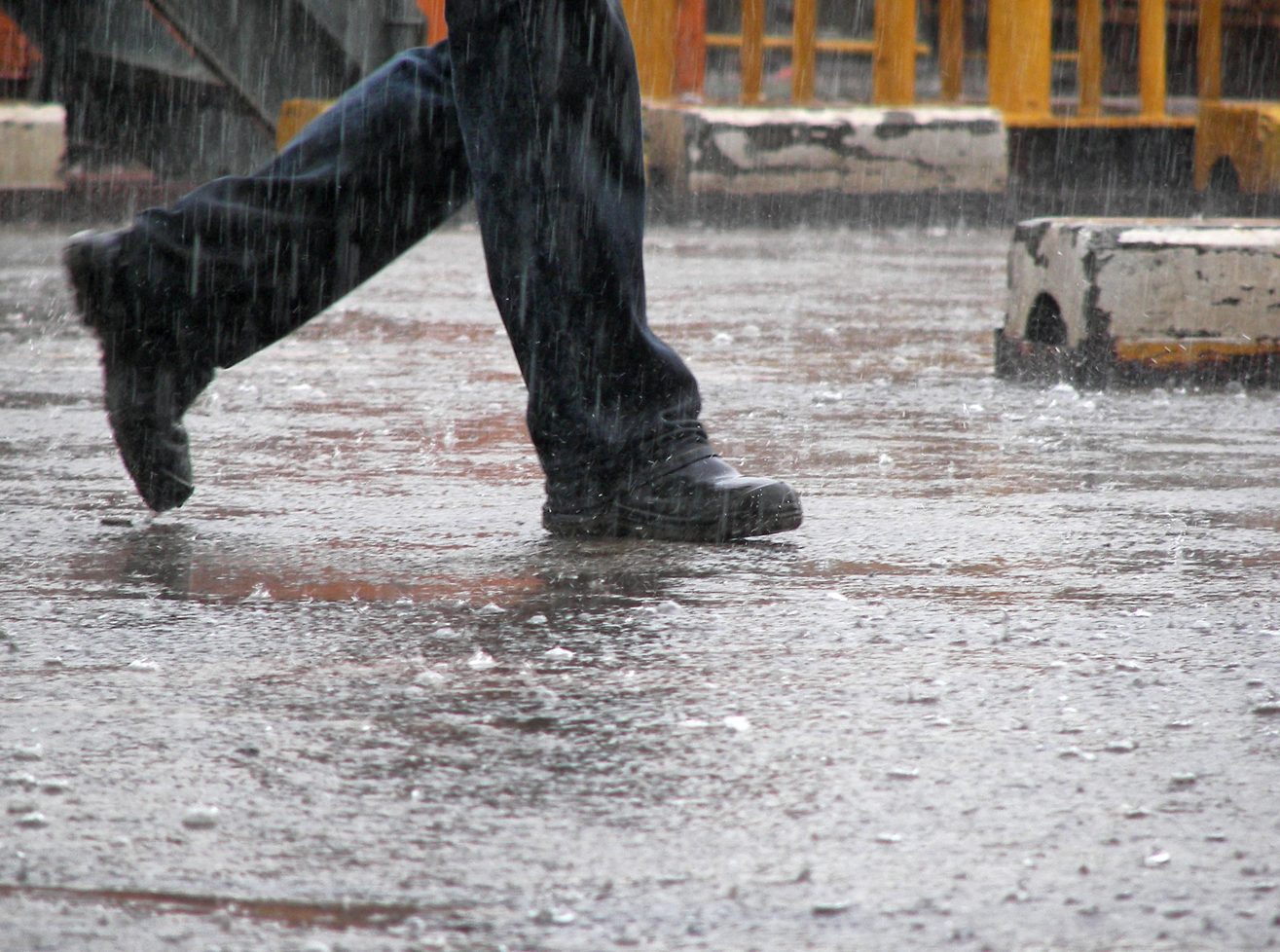 working shoes walking under the heavy rain